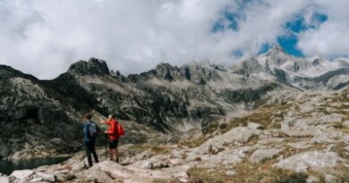 Two hikers on a rocky mountain trail