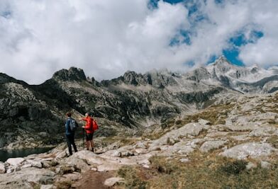 Two hikers on a rocky mountain trail
