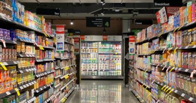 grocery store aisle with stocked shelves