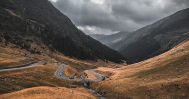 a winding road through a valley