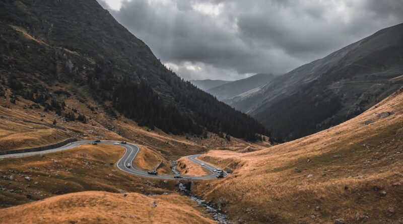 a winding road through a valley